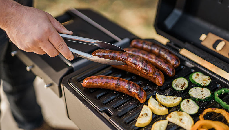 Grilling Brats over Portable Charcoal Grill