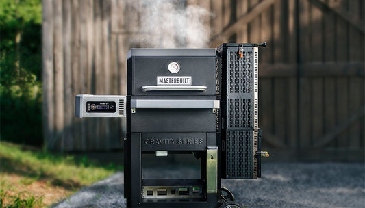 Smoke comes out of a Gravity Series 800 set up in a back yard