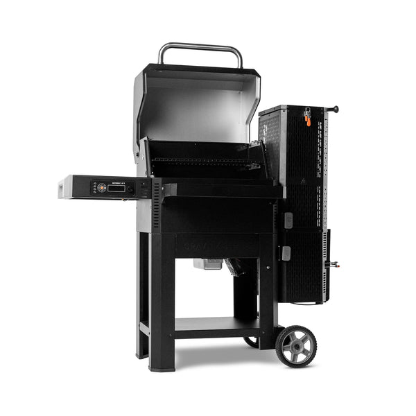 Open Gravity Series 600 grill angled so the left side is closer to the viewer. The left side shelf with the digital control panel mounted beneath it is clearly visible.