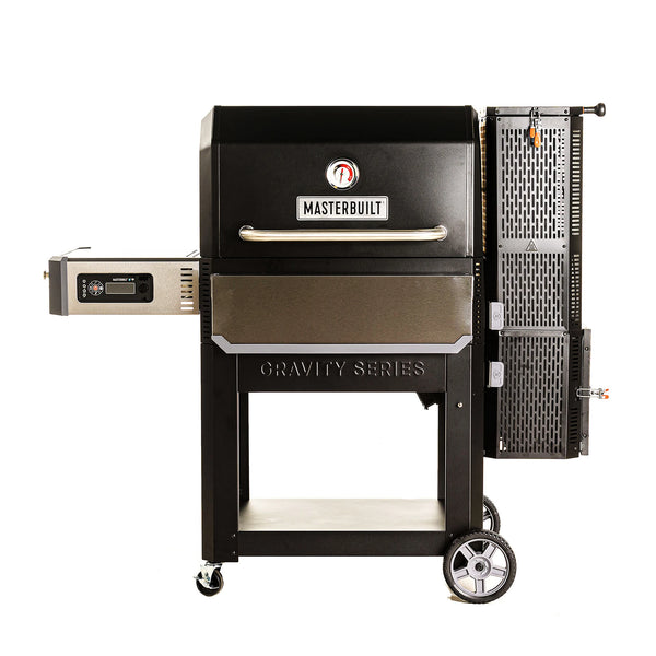 Masterbuilt Gravity Series 1050 grill on a white background. Grill is black with silver side and front shelves. GravityFed™ Hopper is on the right, side shelf with digital control panel underneath is on the left.