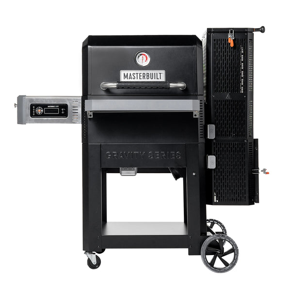 The Masterbuilt Gravity Series 900 Digital Charcoal Grill and Smoker on a white background. The grill is mounted on a wheeled cart with a solid metal shelf between the legs. The charcoal hopper is to the right of the grill and the control panel is mounted under the side shelf to the left.