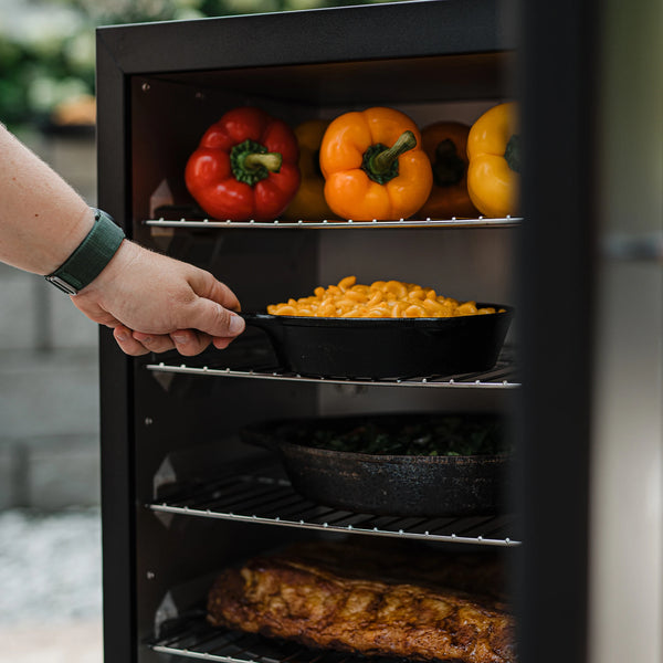 4 racks provide plenty of room. Shown here from top rack down are racks with: 6 bell peppers, a cast iron skillet of mac and cheese, a cast iron dish full of vegetables, and a whole rack of ribs.