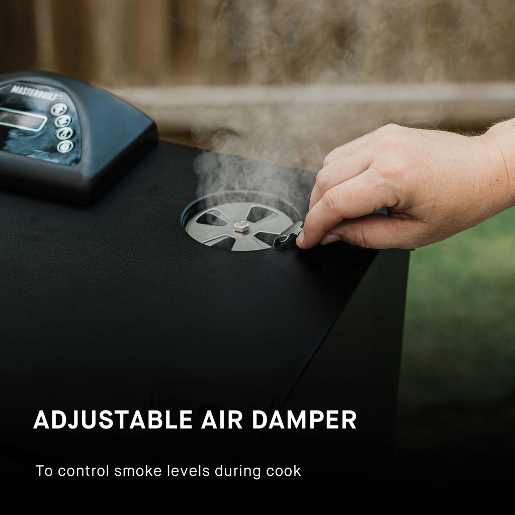 A close-up of a hand adjusting a metal damper on the lid of a black grill, with visible steam or smoke rising. Text on the image reads 'ADJUSTABLE AIR DAMPER To control smoke levels during cook.'