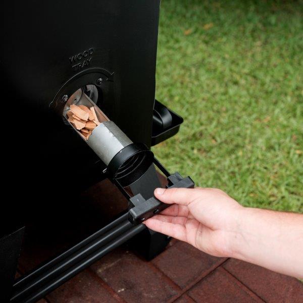 Side wood chip loader allows you to add chips without opening smoker door and losing heat