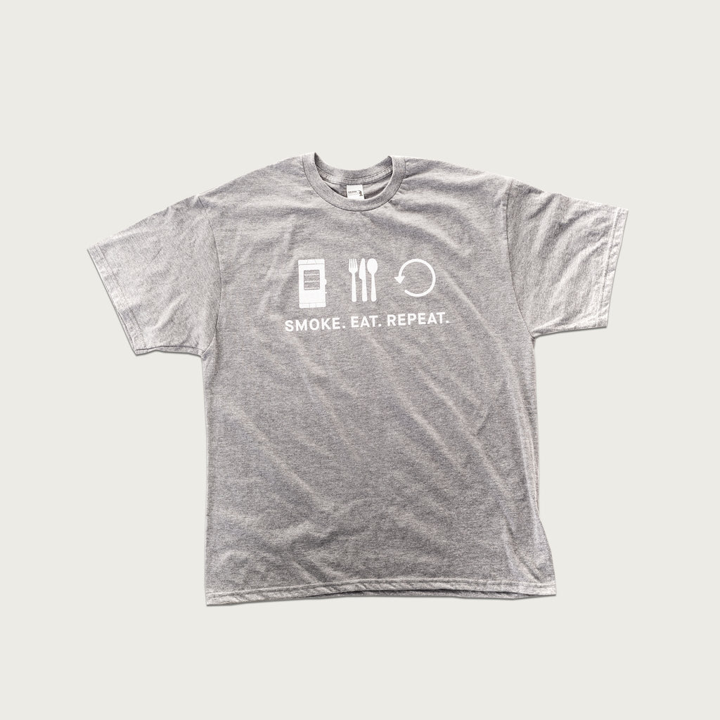 Light gray short-sleeved t-shirt with "Smoke. Eat. Repeat" and icons for each word printed in white on the front